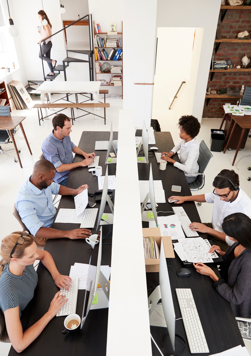 Colleagues Working at a Busy Open Plan Office